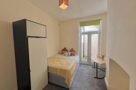 A bright and inviting double bedroom featuring ...