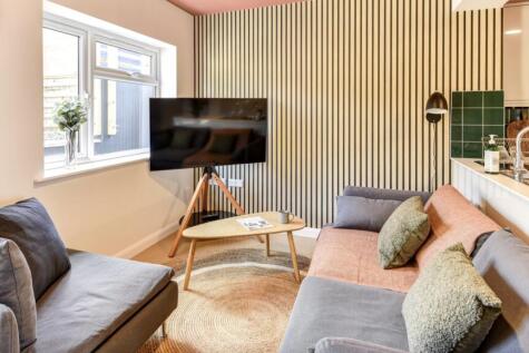 Experience a cozy and stylish living room featu...