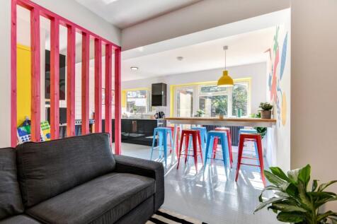 Bright and modern living space featuring a comf...