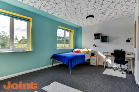 Bright and cheerful single bedroom with vibrant...
