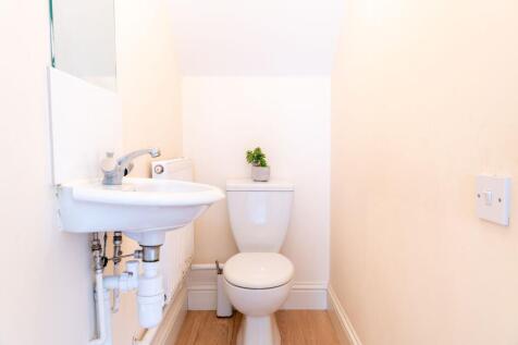 Compact, well-maintained WC with a modern white...