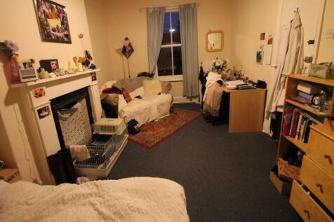 A cozy and inviting master bedroom featuring a ...