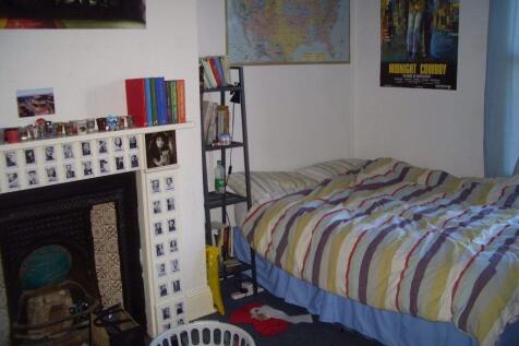 Cozy and welcoming bedroom featuring a comforta...