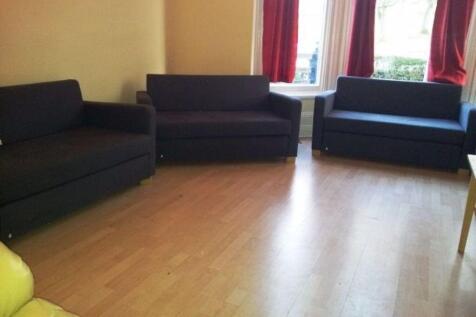 A bright and welcoming living room featuring th...