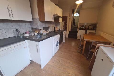 Bright and functional kitchen with clean counte...