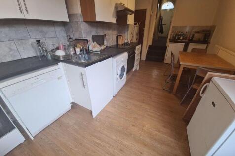 A clean and functional kitchen space with moder...