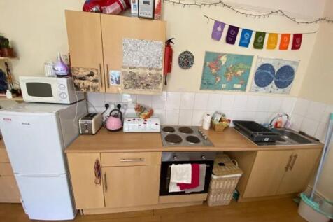 A compact and practical kitchen space featuring...