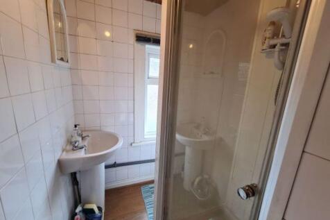 Bright and clean bathroom featuring a spacious ...