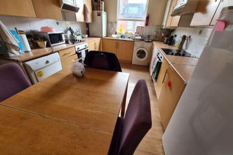 Bright and functional kitchen featuring ample w...