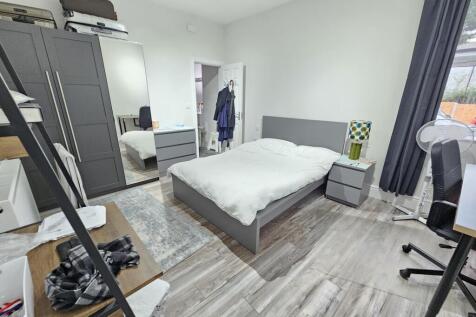 Bright and modern double bedroom featuring a co...