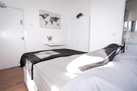 Bright, modern bedroom with a comfortable doubl...