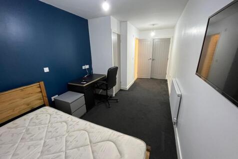 Bright, modern bedroom with a statement blue fe...