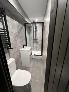 Contemporary tiled bathroom with a walk-in show...