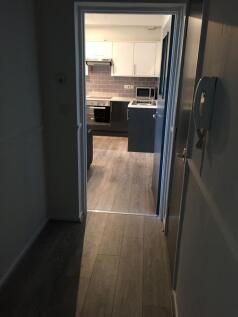 Modern kitchen with white and dark grey cabinet...