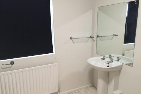 A clean, well-maintained bathroom featuring a p...