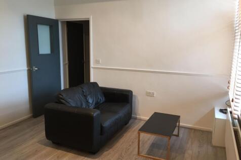 A bright and inviting living room featuring a b...