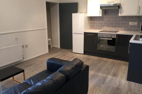 Contemporary living room featuring a black leat...
