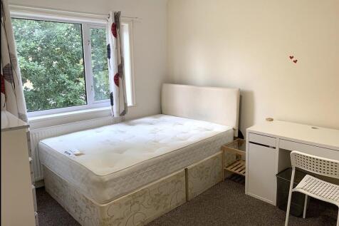 Bright and tidy double bedroom featuring a comf...