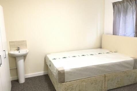 A neat and well-maintained bedroom featuring a ...