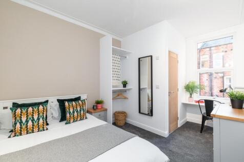 Bright, neatly presented bedroom with a comfort...