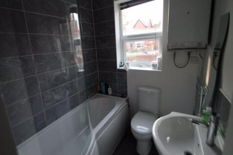 Bright, modern bathroom with a full bath and sh...