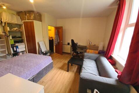 Bright, well-kept bedroom with a double bed, so...