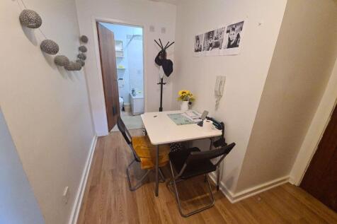 Bright, tidy shared dining or study nook with a...