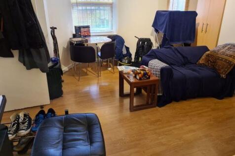 Bright, well-kept living area with wooden floor...