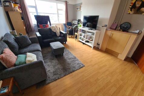 Bright, contemporary living room with comfortab...