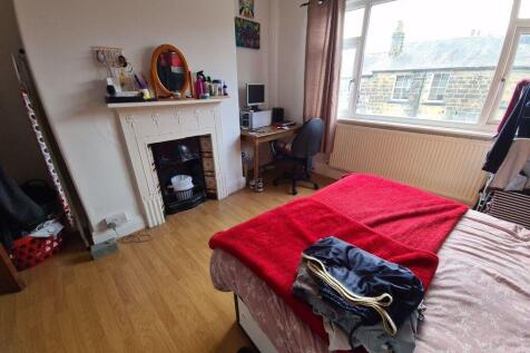 Bright, well-presented bedroom with a large win...