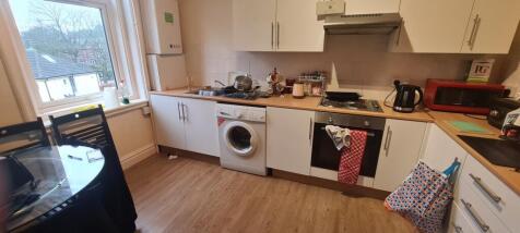 Bright galley-style kitchen with plenty of coun...