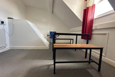 Bright communal workspace featuring a modern ta...