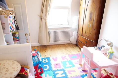 A cheerful and vibrant double bedroom featuring...