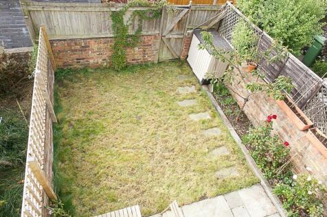 A charming garden space featuring well-maintain...