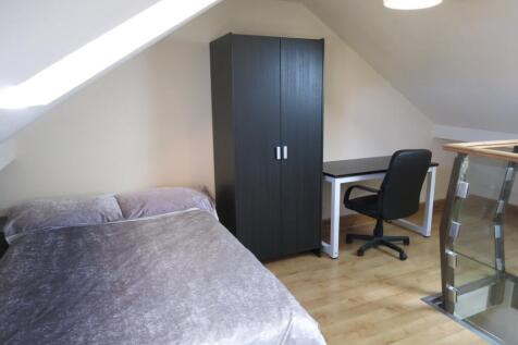 Bright and tidy double bedroom featuring a comf...