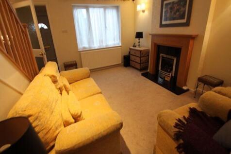 Warm, well-presented living room with comfortab...