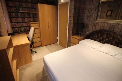 Bright, neatly presented bedroom with a comfort...