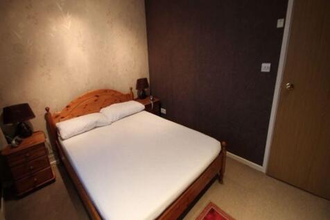 Neat double bedroom with a wooden double bed, c...