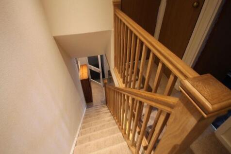 Carpeted internal staircase with sturdy wooden ...