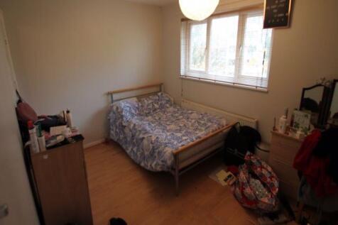 Cozy furnished bedroom with a single bed, woode...