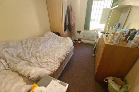 Cozy furnished bedroom with a double bed, wardr...