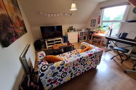 Bright, well-decorated living room with a color...