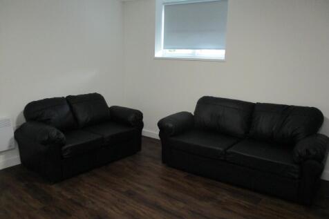 A modern living room featuring two comfortable ...