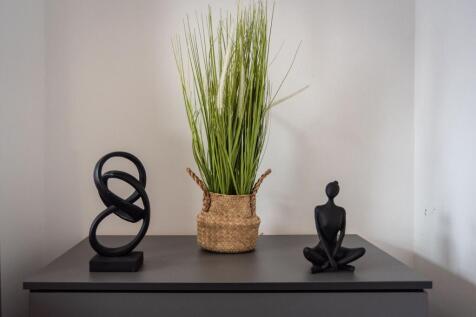 Neutral-toned hallway or entrance surface style...