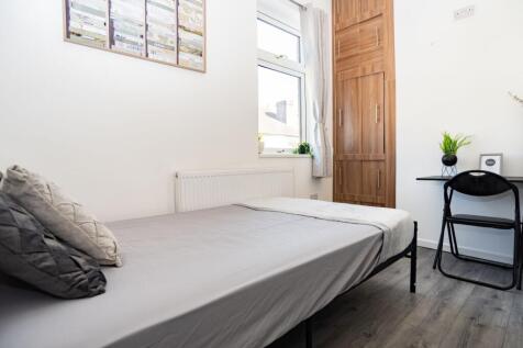 Bright, neatly presented bedroom with a comfort...