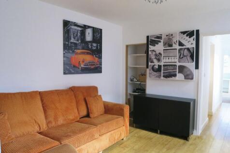 A contemporary living room featuring a stylish ...