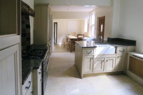 Bright and inviting kitchen with ample cabinetr...