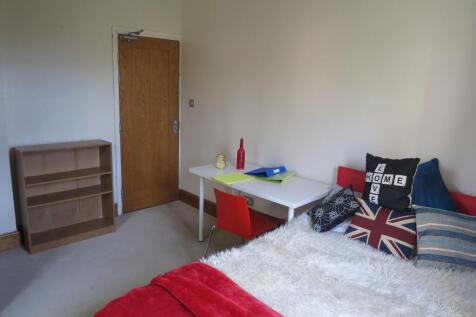 A bright and welcoming living area featuring co...