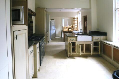 A spacious kitchen with a classic design featur...