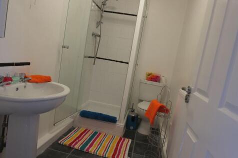 A clean and functional bathroom featuring a sin...